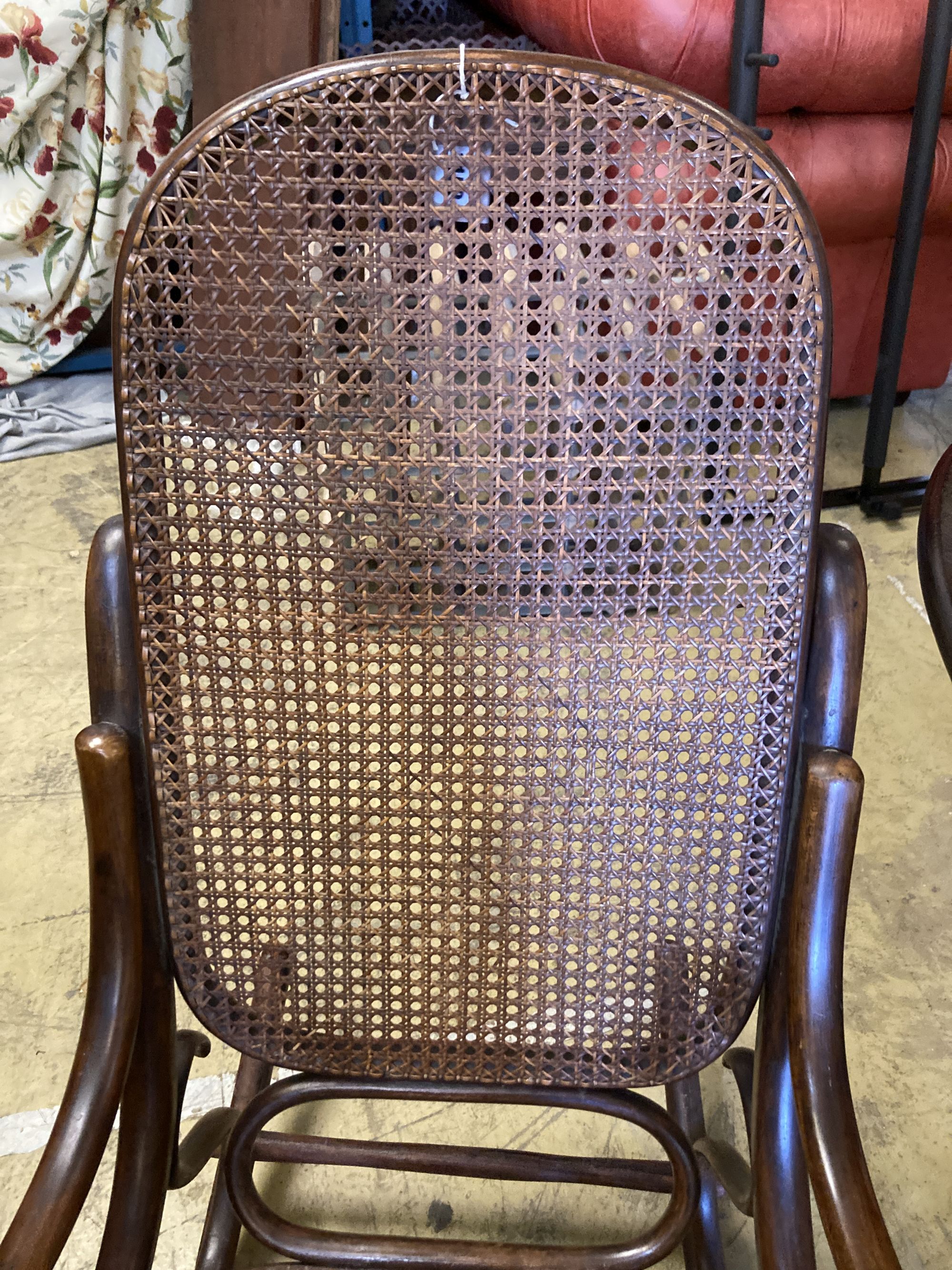 An early 20th century Thonet style caned bentwood rocking chair